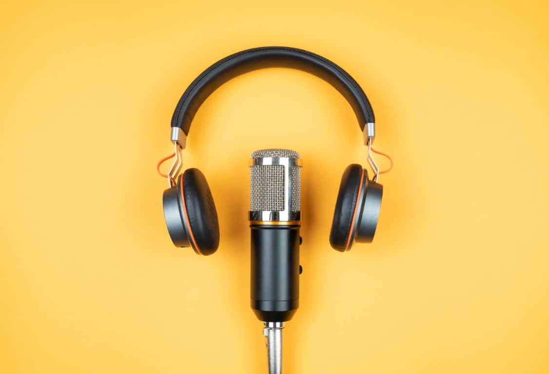 podcast A pair of headphones with a microphone.